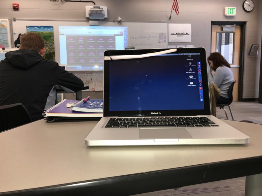 WORKING HARD IN JOURNALISM - using an Apple MacBook Pro