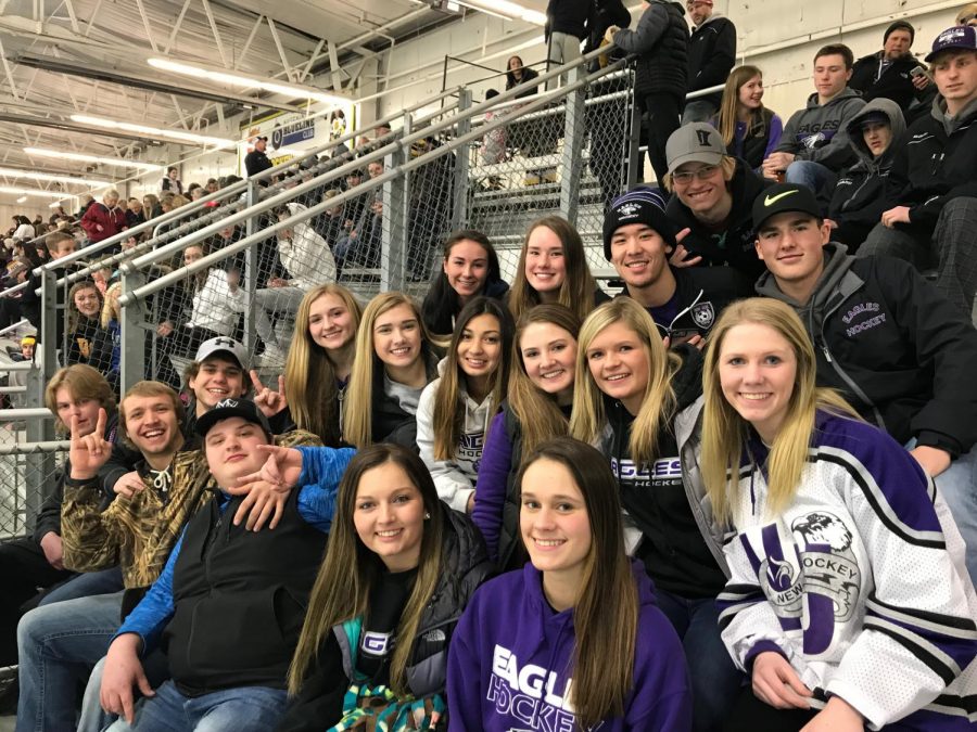 HERE WE GO EAGLES squadron cheers on boys hockey at their last game 