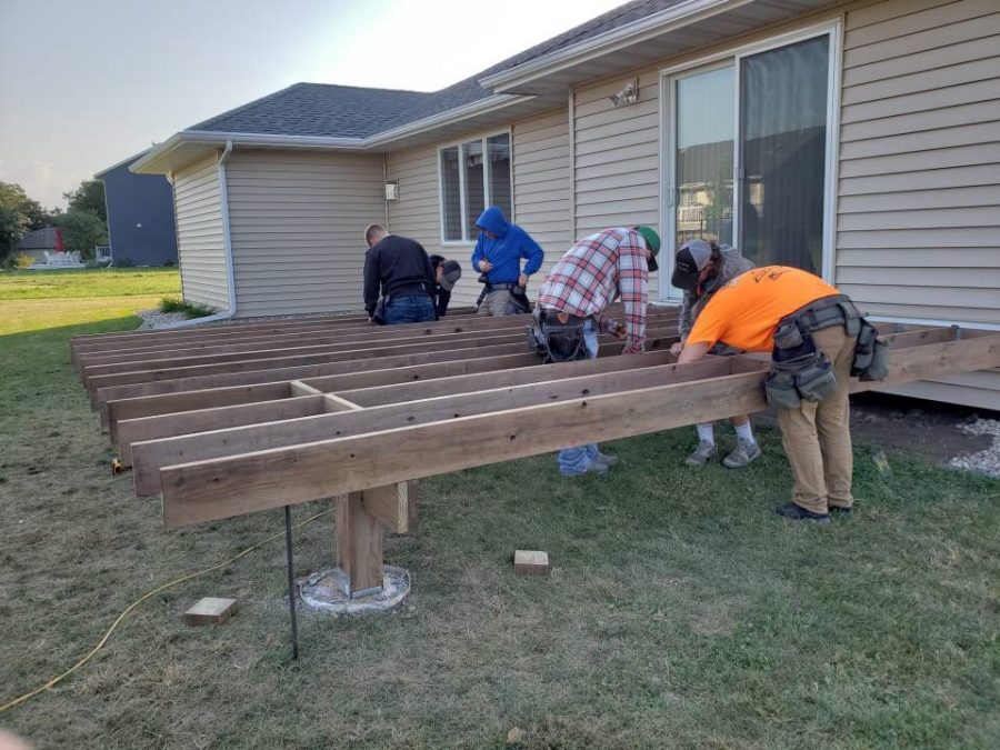 NUHS students working on the deck project.