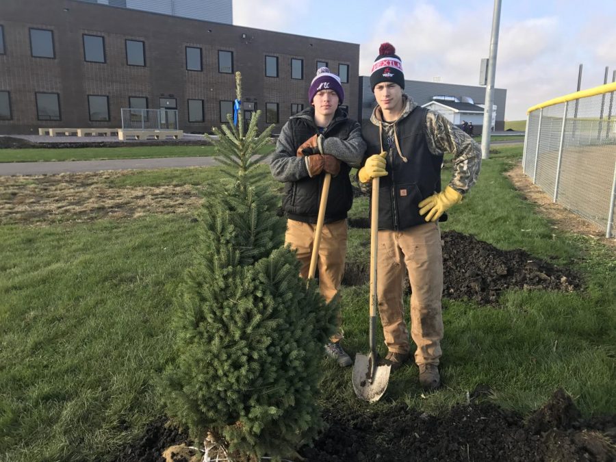 Stuart Hartley (left) and Landon Depew (right) pose for a picture while planting trees on Saturday, October 13th.