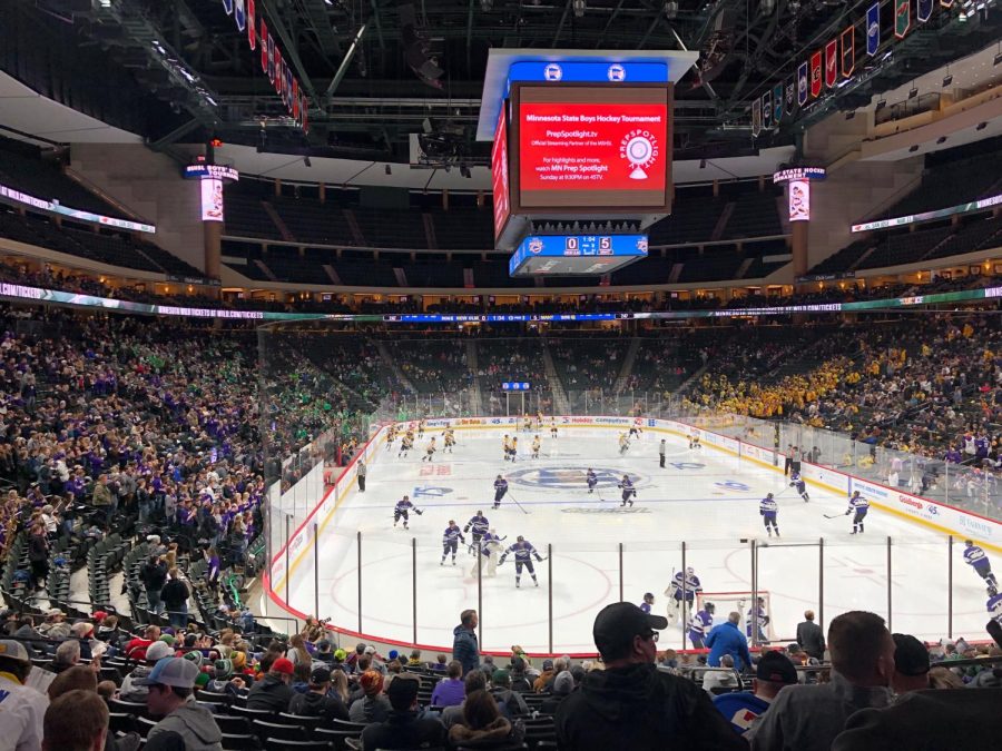 New Ulm boys hockey team skates out to a cheering Squadron at the Xcel Energy Center during the high school state boys hockey tournament.