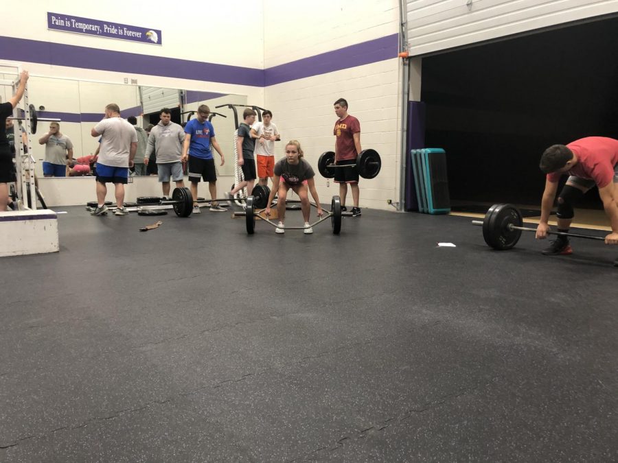 Mr. Leisers morning weightlifting and conditioning class working for big gains while lifting weights.