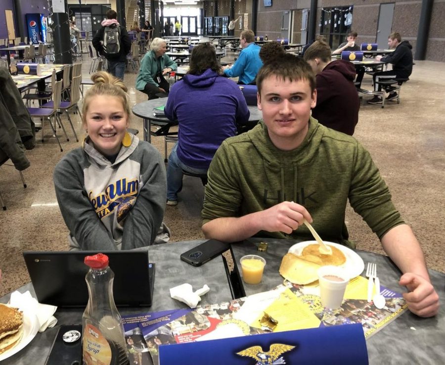 Abby Voges (left) and Russell Hellendrung (right) enjoying pancakes for breakfast