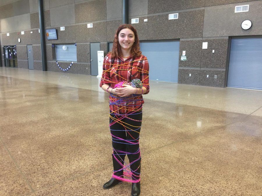 Freshman, Ella Weisbrich, wraps herself up in her own Loom Band chain
