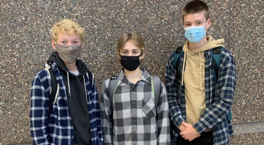 Students (from left to right) Adam Wiltscheck, Bryer Lang, and James Osborne dressed up in flannels for flannel day.