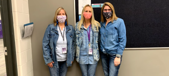 Paraprofessionals at New Ulm High School (left to right) Kathy Wendland, Bobbie Altmann, Kelsey Clobes participating in the homecoming dress-up day, double denim, on Tuesday. I am glad that the kids get to have some normalcy this year by having the dress-up days and coronation, but I am sad for them, I wish that everything could be back to normal for their sake, Wendland said. 