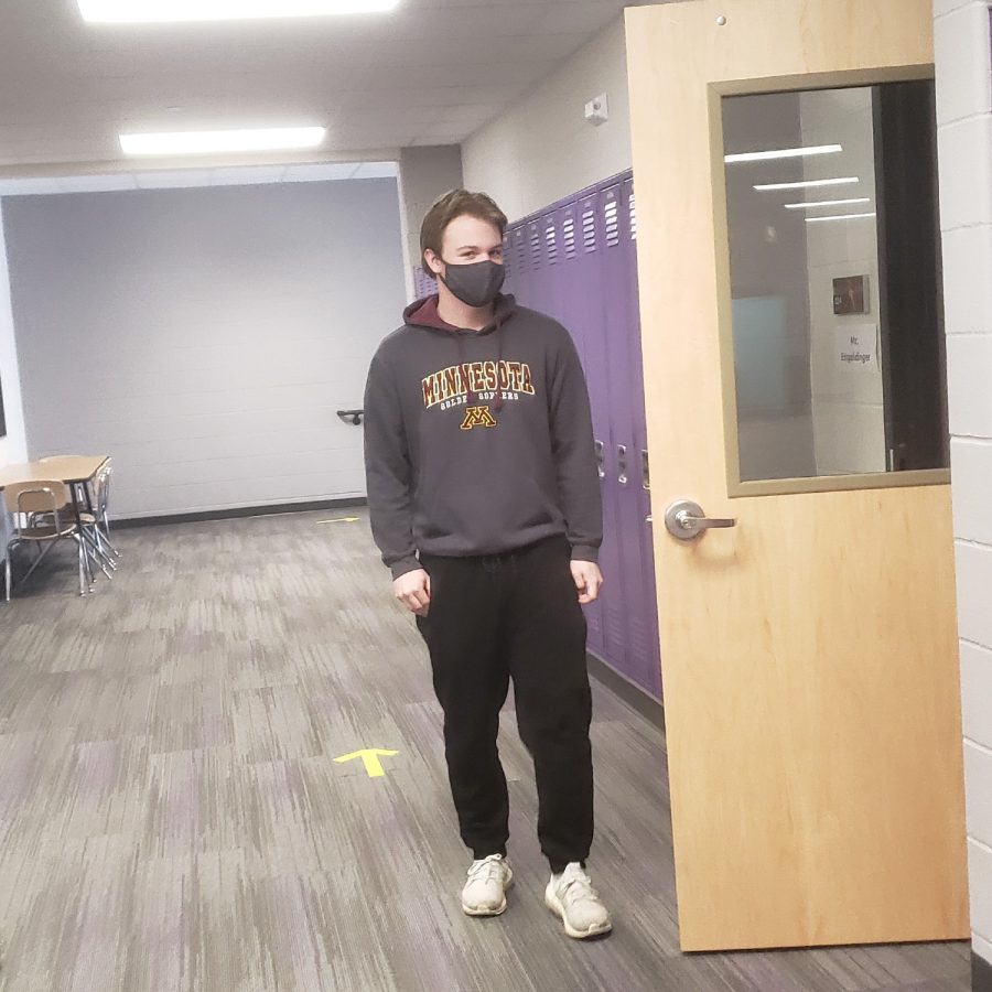 New Ulm High School Senior, Carson Helget, Boasts Mask While Entering Class.
