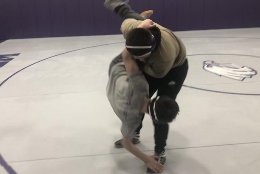 Dylen Carreon takes down another wrestler in practice