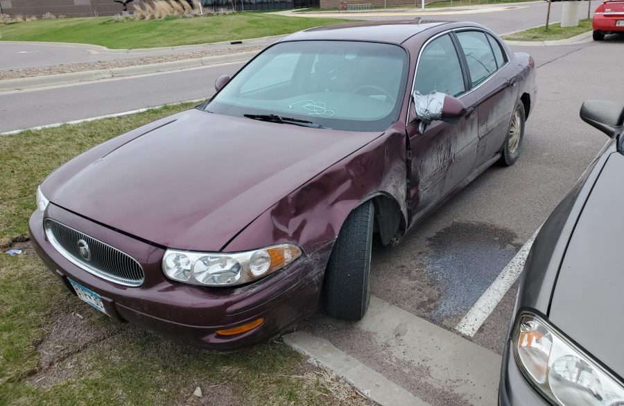 Damon Warwick´s, a New Ulm senior´s, car has been through lots of trouble. From hitting deer to hitting other cars themselves student drivers tend to give their cars a tough time. ¨The taped-on mirror was my idea and has worked since, Damon has to say about his car. 