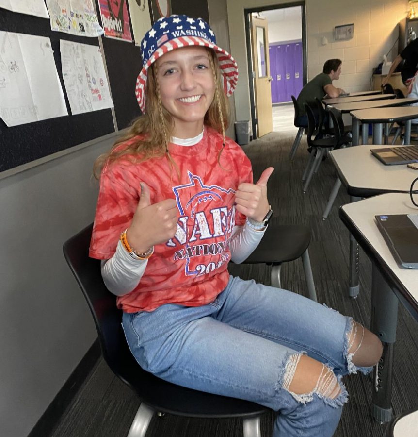 Anna Lee celebrates eagle pride by wearing red, white, and blue. 