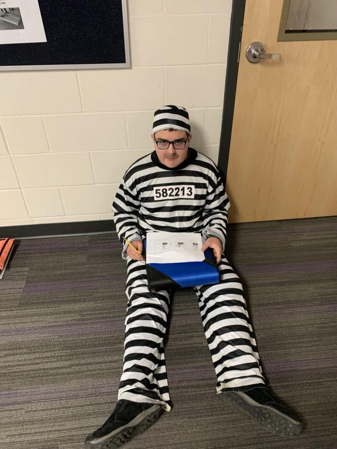 9th grade Dominic is dressed as an inmate for Halloween. 
