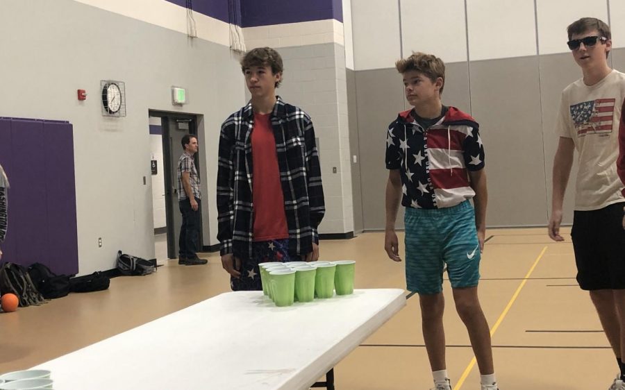 Some freshmen play water pong with seniors. And the seniors won the game.