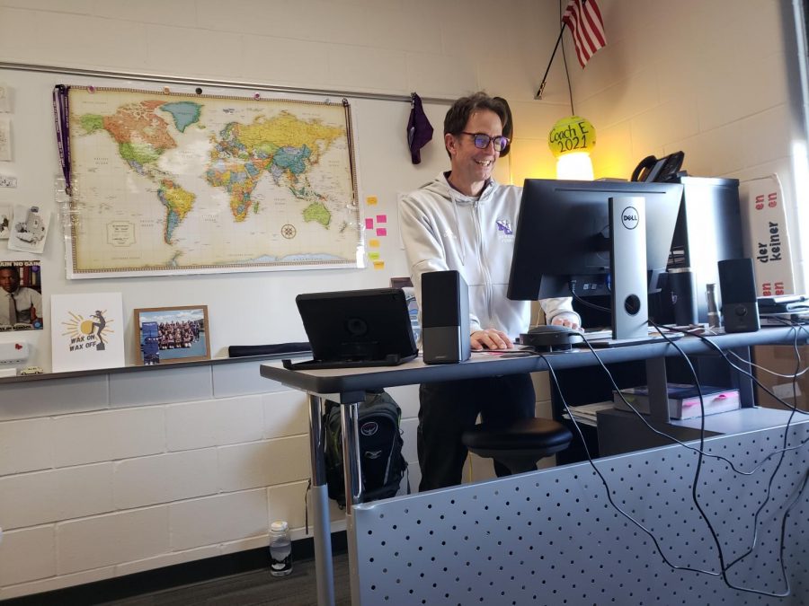 Mr. Engeldinger smiling while on his computer. 