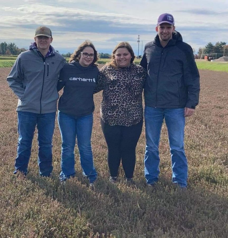 FFA members Tyler Sondag, Allie Schwab, Sam Schwab, and Andrew Hellendrung visiting cranberry field in Wisconsin.