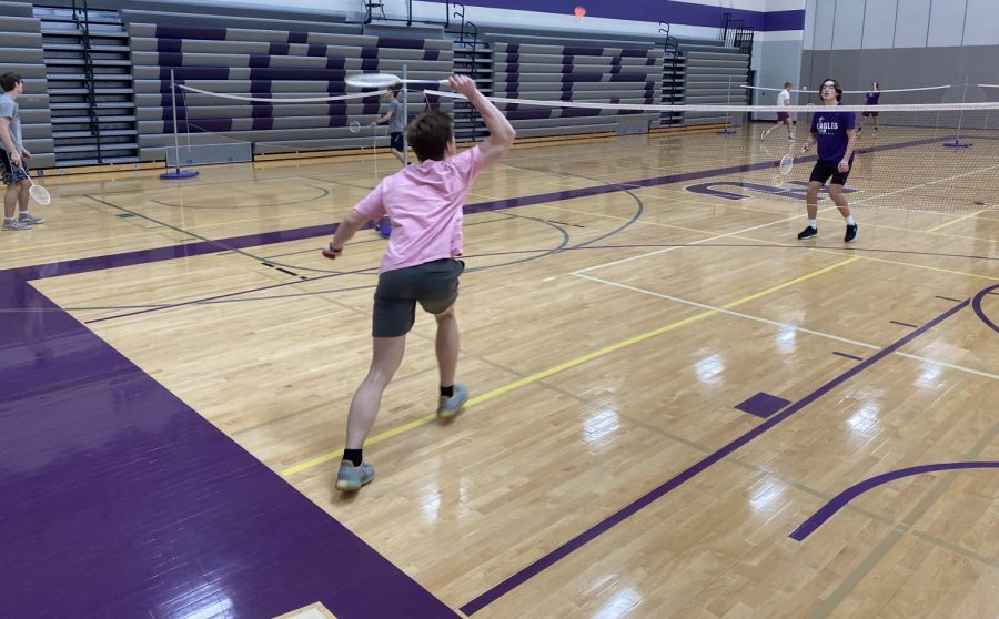 Students Dylan Sickles and Luke Steffensmeier volley in badminton
