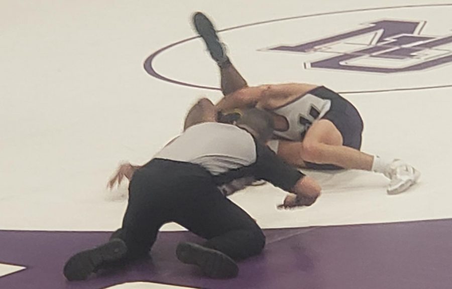 Winsten Neinhaus going for the fall in Tuesday nights action against Sibley East 