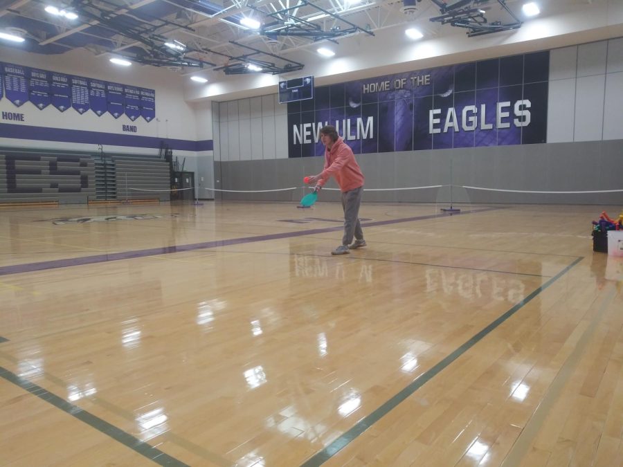 Adian Eckstein gets ready for a serve while playing pickle-ball in the NUHS gymnasium for the fourth annual pickle-ball tournament on Feb. 3, 2022. I love to play pickleball and would like to challenge Mr. Engeldinger, Eckstein said.