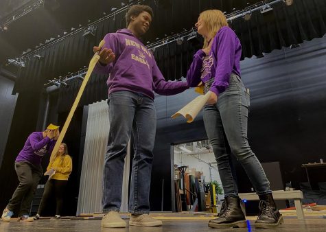 Senior Marcarious Amoah  and Junior Josie Ringhofer acting out a scene between their characters: Prince Charming and Cinderella. 
