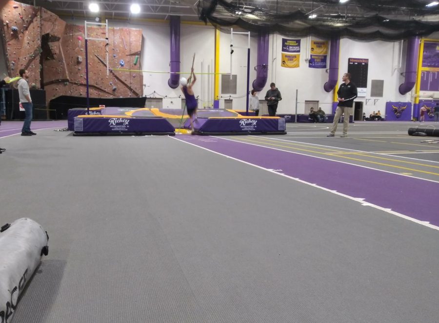 Anthony Gonzales attempts to clear a bar in the pole vault event at NUHS Track & Fields first meet of the year located at the MSU indoor track.