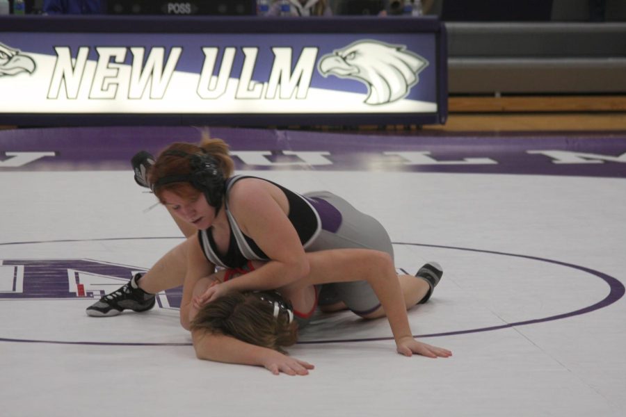 Ellie works to pin her opponent at a meet earlier this season.