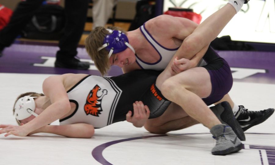 Parker Kamm pinning his Marshall opponent at the home meet earlier this season.