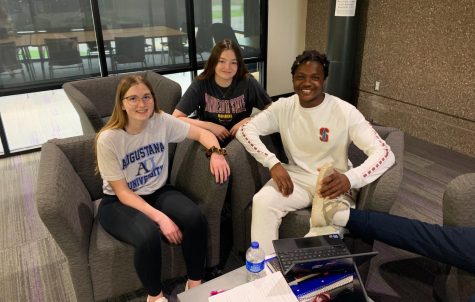 Seniors Jenna Ebert, Alex Vigil, and Marcarious Amoah dressed in their college gear for college decision day on Wednesday, May 11 to alert fellow peers on where they will be headed next year. 