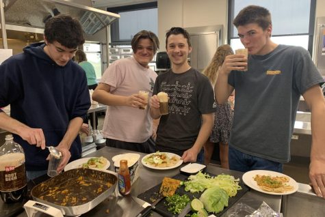 Seniors Vincent Leske, Cameron Sherrod, Tucker Griebel, and Jacob Furth used $20 given to them through NUHSs Survival class to budget for nachos and root beer floats at the local Hy-Vee. 