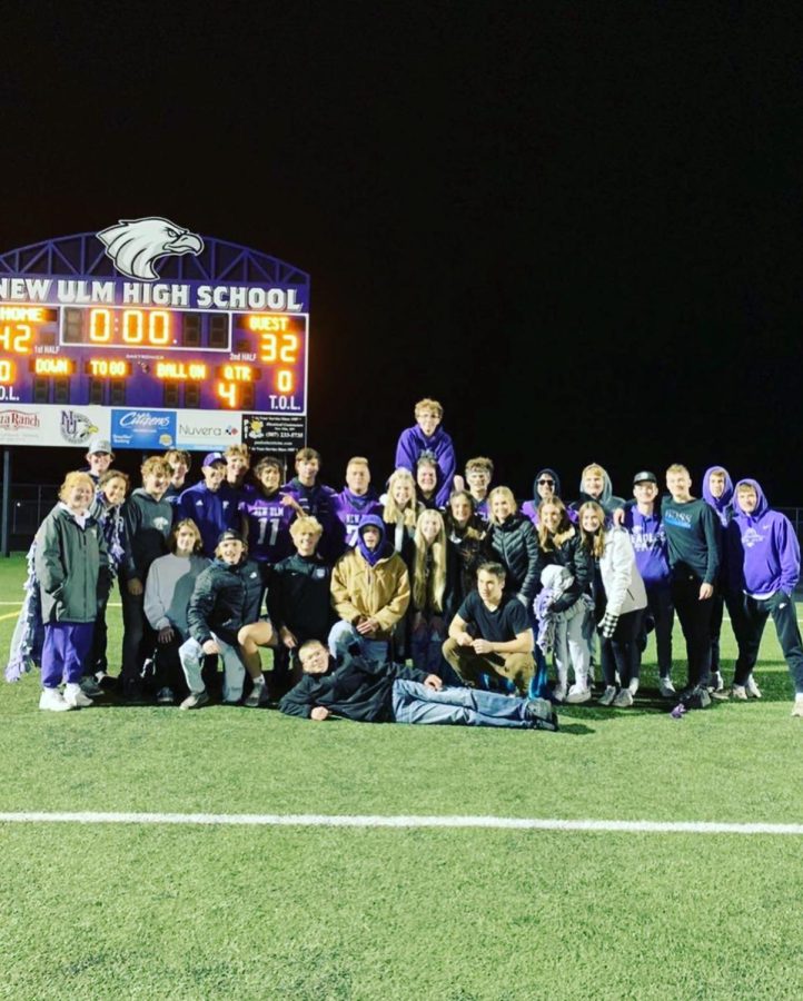 The Seniors gathered at the end of the homecoming game  in front of the winning scoreboard.