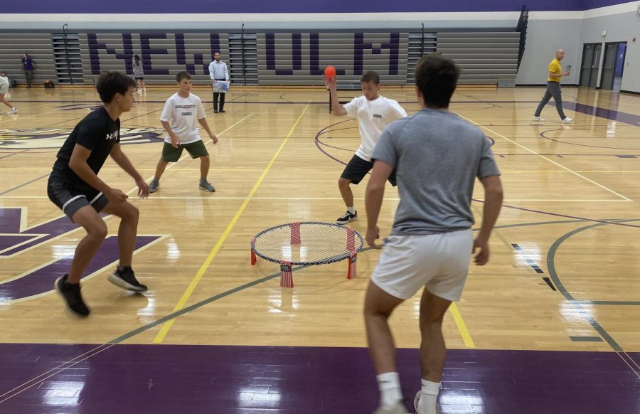 Seniors Colin Horning and Nick Zins face freshmen in spike ball.