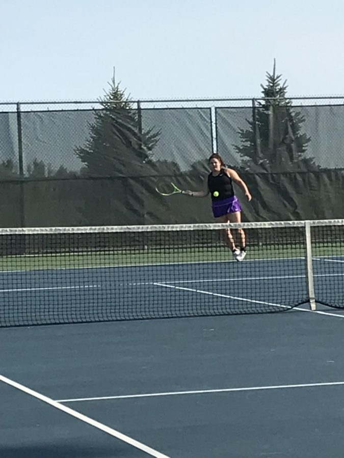 Sophomore Jocelyn Petterson recently playing in a varsity tennis match vs. the Saint Peter Saints at New Ulm High School. Singles is a lot more running because rallys go longer Jocelyn said. In  a varsity tennis meet there are 7 matches played, 4 singles, 3 doubles.