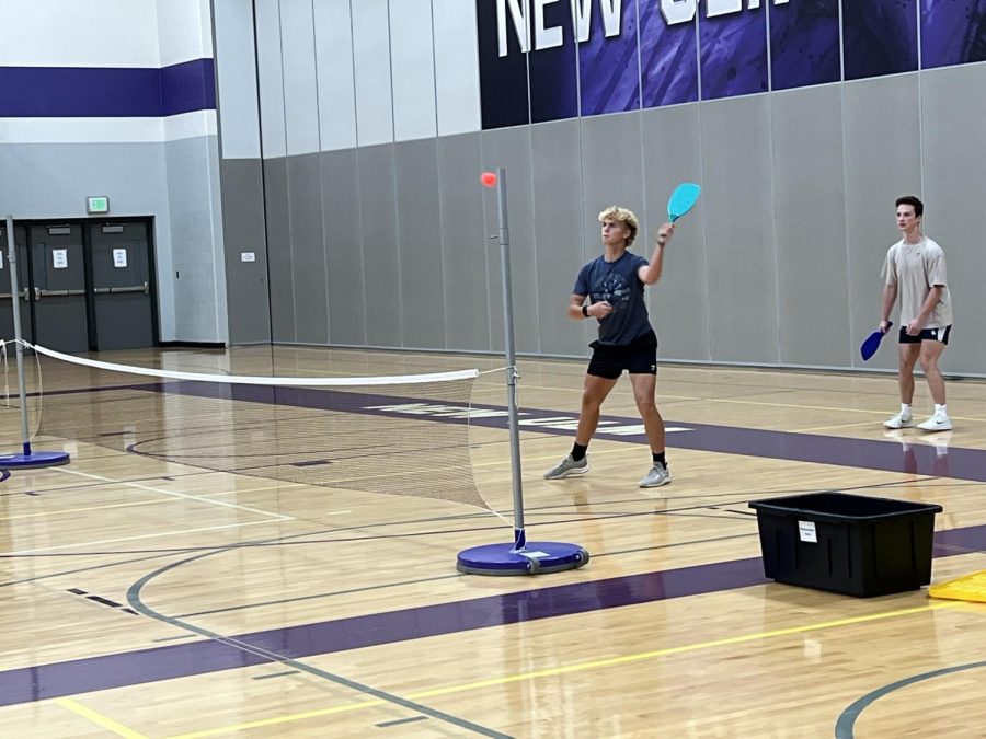 Senior, Leo Waloch, Practices Pickle ball, for Battle of The Classes in the New Ulm High School gym. Hunter Sizer said  This was the very first time Pickle ball was played in BOTC. 