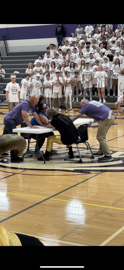 Last moment before Senior Katie Wilker wins arm wrestling. 