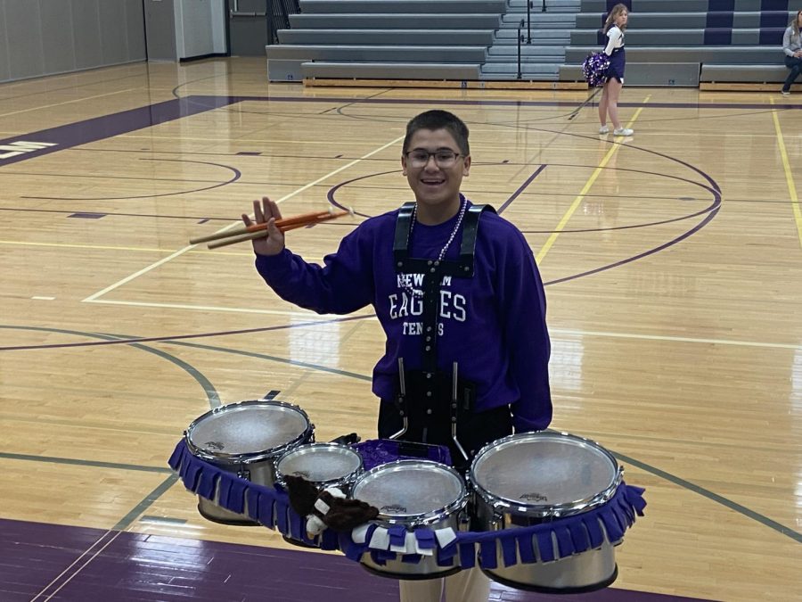 Junior Joey Kotten prepares to perform with the band for the NUHS pep-fest. 