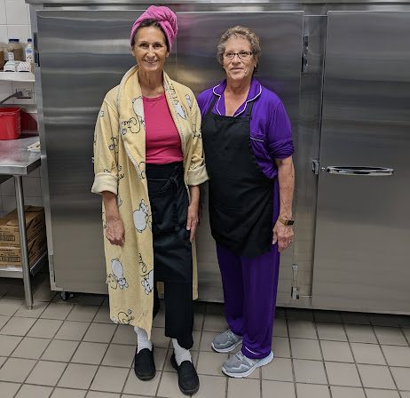 Mitze Marti and Fay Hauer are serving breakfast and lunch while dressed for bed.