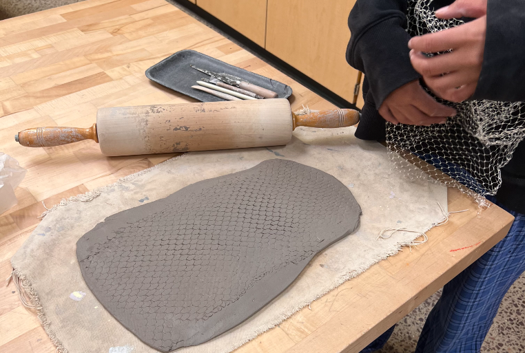 Senior Gloria Foucher makes a clay tray in Ms. Pages 2nd hour Pottery and Sculpture class. Im very eager to see all the things well be making this semester, said Foucher. This is the students second project moving into the new school year.