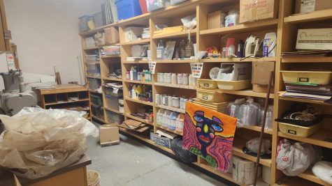 Storage area for the art room at NUHS, where clay is being recycled and a painting is waiting to be placed on the wall.