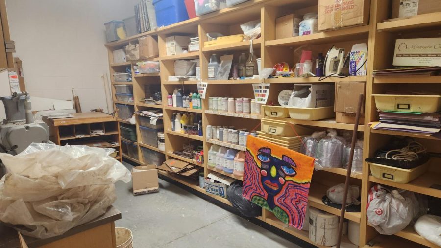 Storage area for the art room at NUHS, where clay is being recycled and a painting is waiting to be placed on the wall.