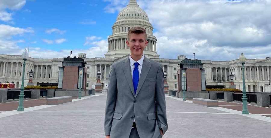 Nathaniel Janssen posing outside the U.S. Capitol Building in Washington D.C.