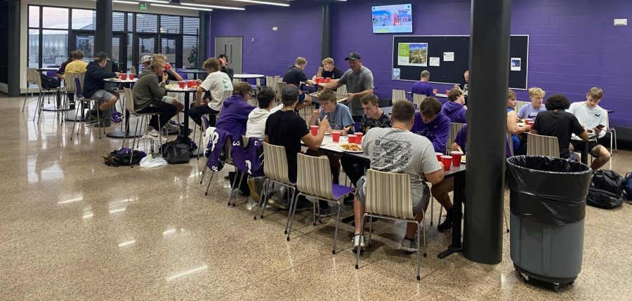 New Ulm Football team eats pasta in preparation for the Waseca game.