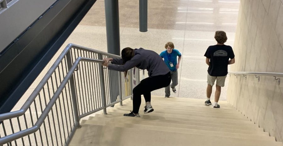 Senior Leigha Grussendorf stumbles down the stairs