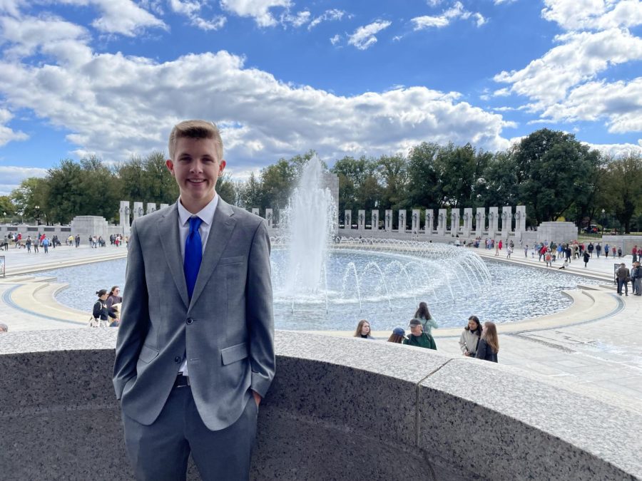 Senior Nathaniel Janssen poses for a quick photo outside of the National World War II Memorial.