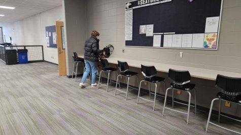 Ivan Neisen sets his backpack down to work on homework in the updated history wing.