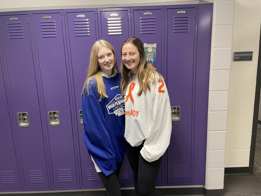Seniors Leigha Grussendorf and Karson Schmid pose in their hockey jeseys for American Education Appreciation week dress up days!