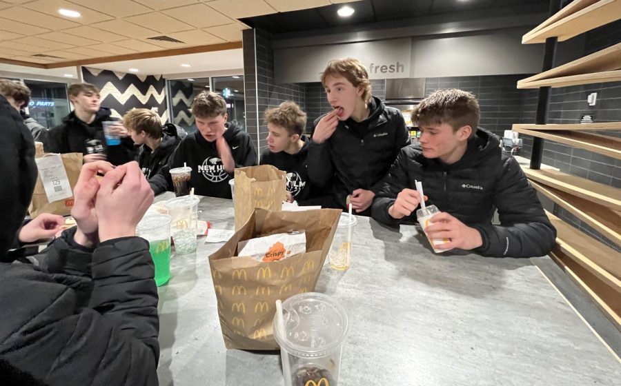 From left (all juniors) Easton Clark, Colton Benson, Will Fossen, Gavin Epper, James Osborne

New Ulm boys basketball enjoys a late meal after they defeat the Tigers 78-67. After the Coaches looked and there was no Kwik Trip to stop at, their normal stop, they chose to stop at Mcdonalds. A quick stop turned into a 20-minute or more stop. Junior Easton Clark makes sure to let everyone know  the ranch is not good.