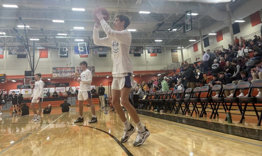 Senior Mason Epper warming up for the New Ulm vs. Marshall basketball game at Marshall High School. The game was January 27. I make sure that I lock down my three-pointer before every game, Epper said. 