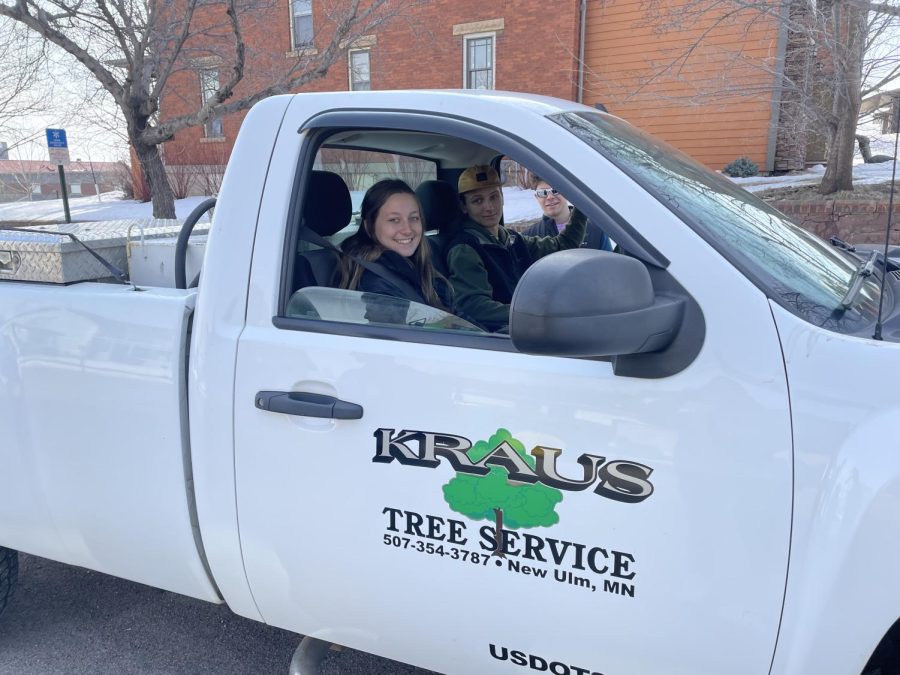 Leigha Grussendorf (left), Dawson Kraus, and Jack Albrecht waiting their turn to show off the family business at the ag day parade.