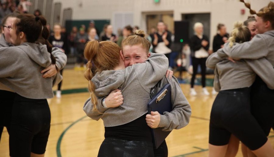 Senior Chloe Miller (left) and Junior Kadence Lund hugging after winning first place.