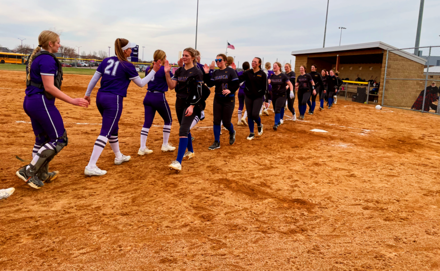 New Ulm Eagles softball high-fiving the Waseca Bluejays after an 11-0 win on Tuesday, April 18.  