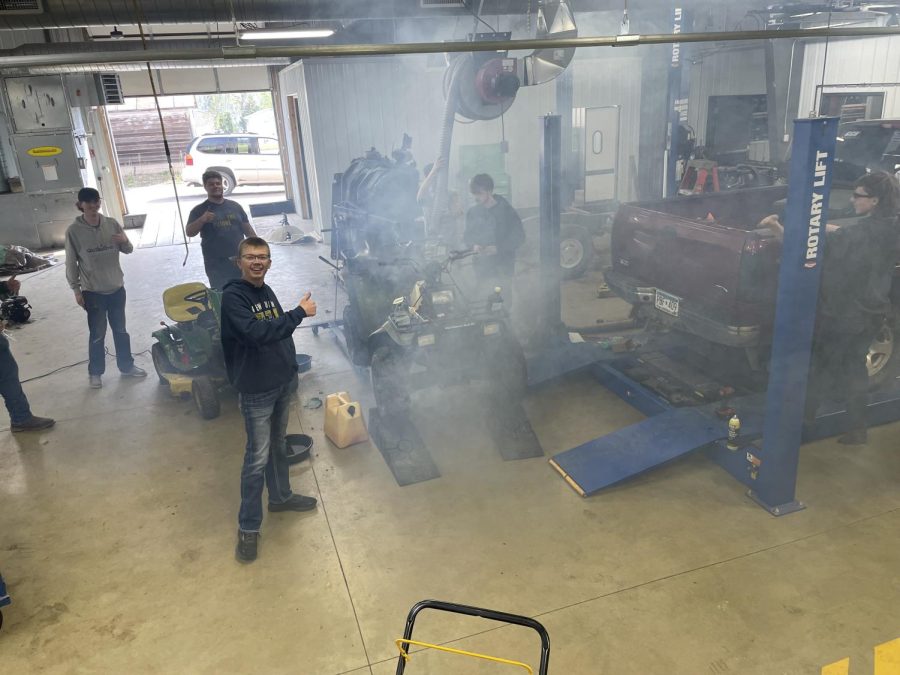 Ethan Dakes Sportsman smokes out shop. Dake brought in a 4-Wheeler that he bought cheap and got running withing a day. He is currently struggling with getting his lights working properly. The Sportsman smoked out the shop cause he put to much oil and not enough gas in it. Dake said soon as it is done we go Sportsmaning. 