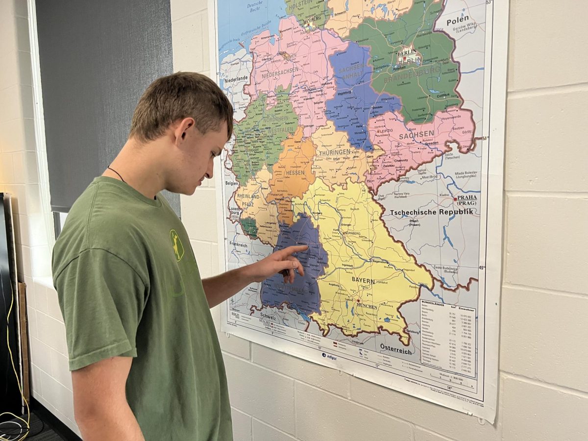Kolbe Plaetz looks at a map of Germany. 